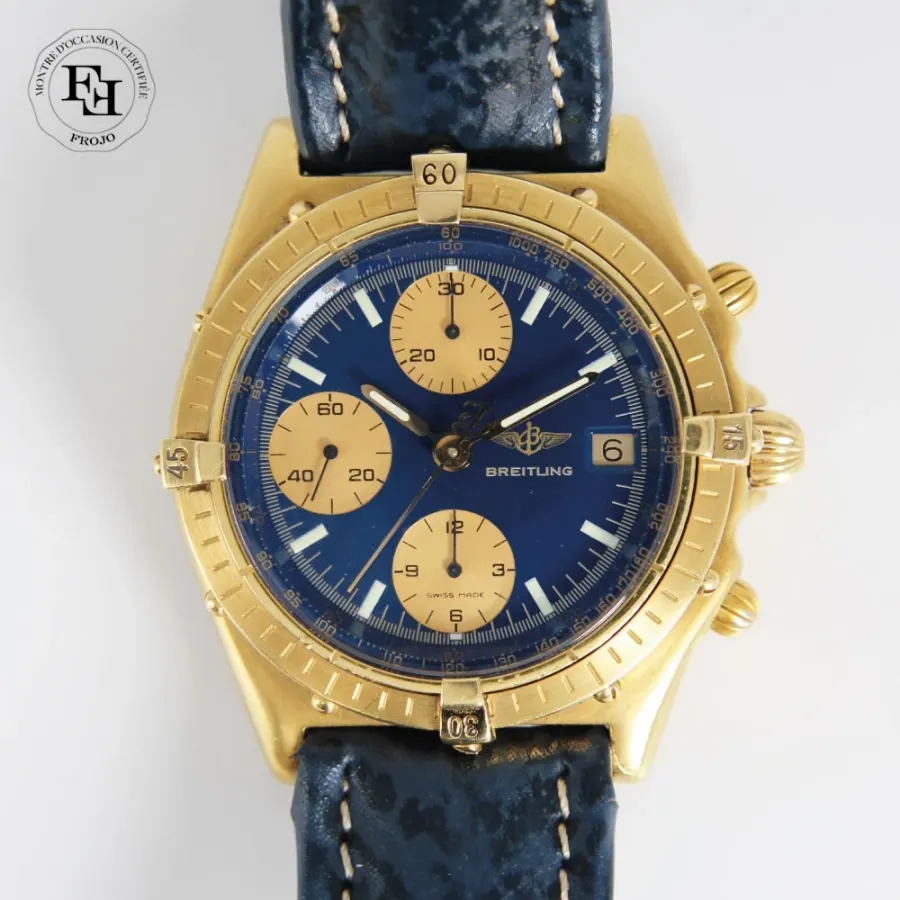 Breitling Chronomat vintage automatique or jaune cadran bleu compteurs dorés bracelet cuir bleu 39mm