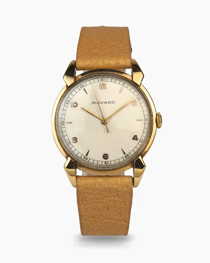 Movado Time only in 18 karat gold with claw lugs